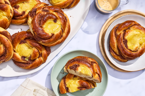 Sunshine buns on plates and arranged on a counter, seen from above. - select to zoom